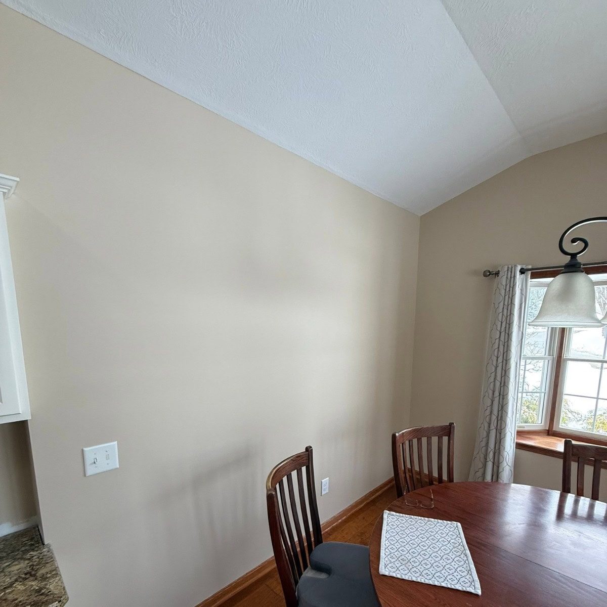 Interior painting after photo — dining area walls painted Kilim Beige SW 6106 in North Royalton, OH